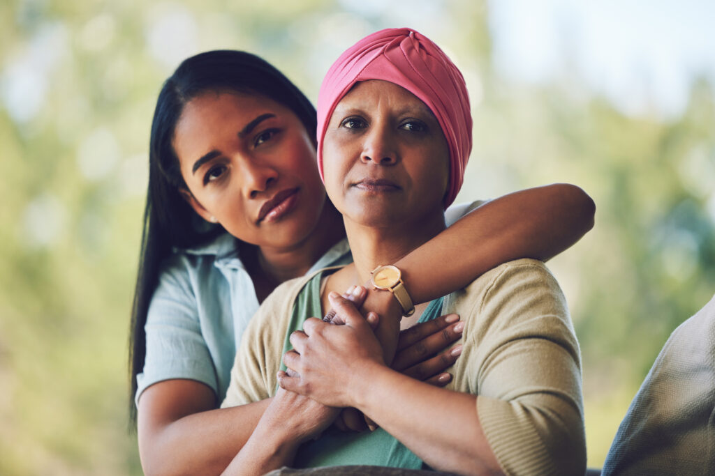 Portrait of mother with cancer, adult daughter in garden and support, love and care in family.